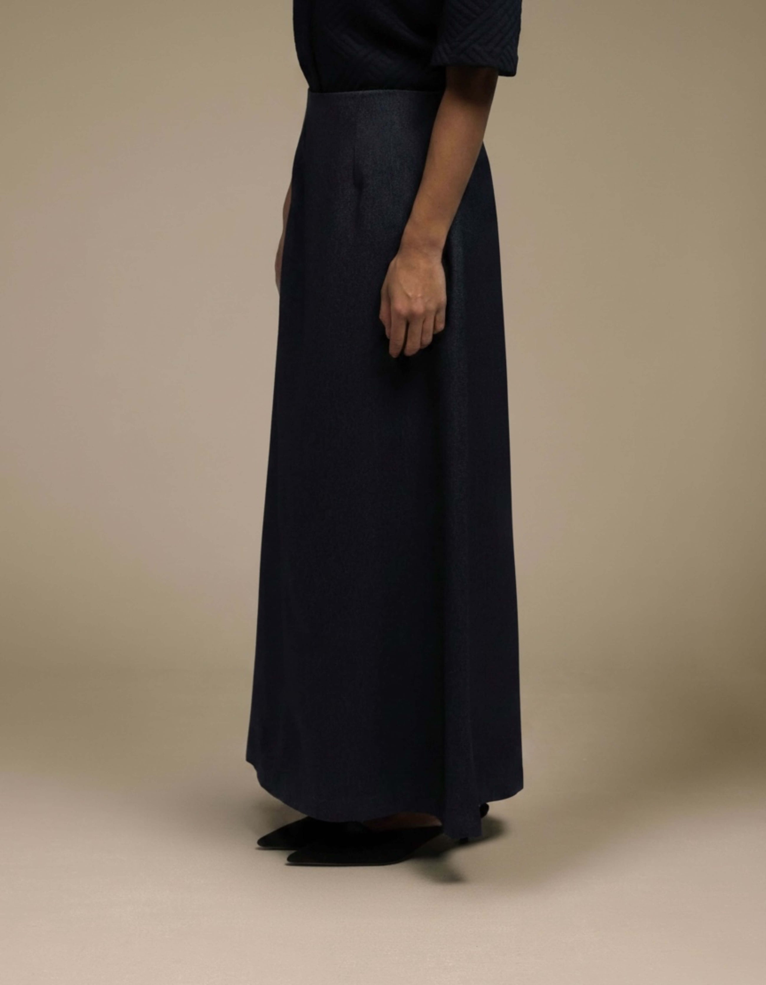 Navy A-line maxi skirt minimalist luxury womenswear side profile