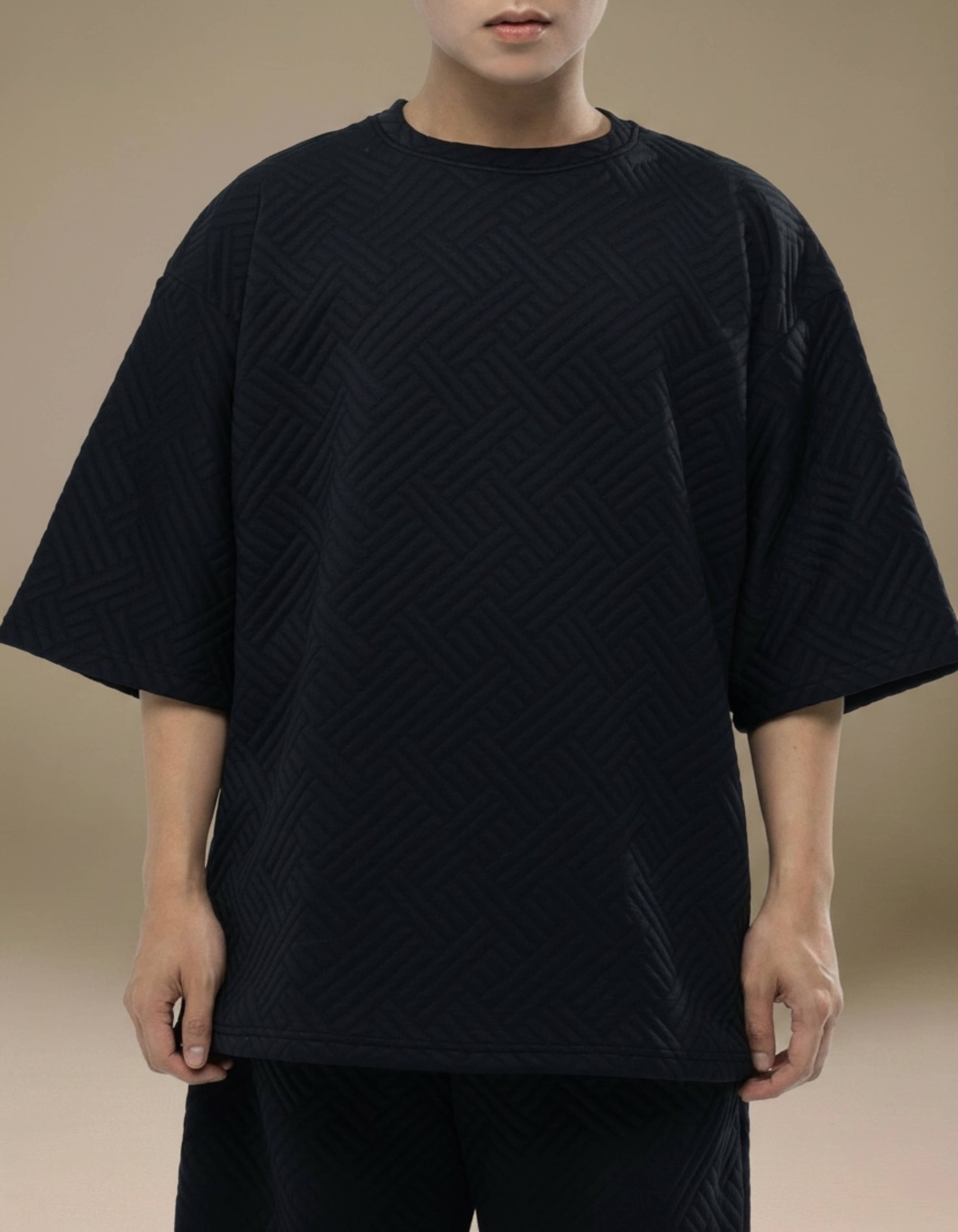 Black oversized quilted geometric top minimalist luxury womenswear