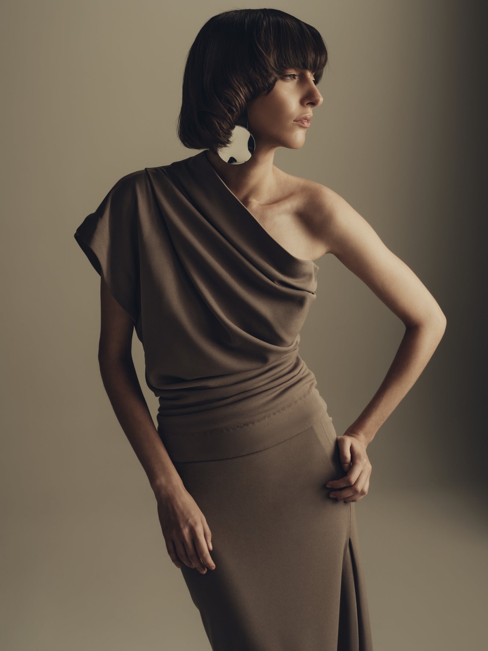 Draped one shoulder minimalist midi dress in warm taupe
