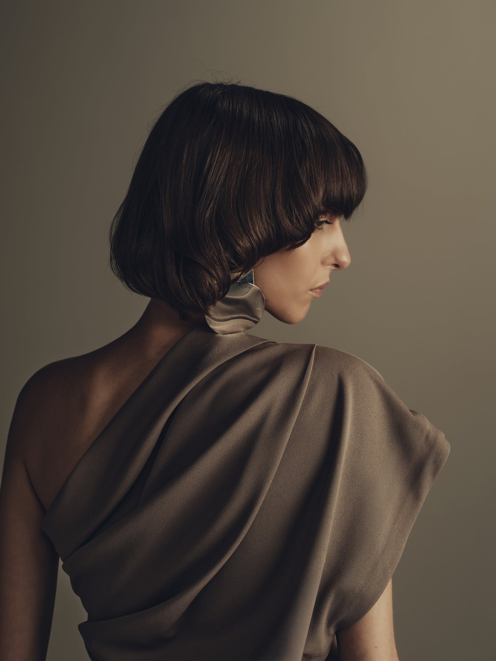 Draped taupe one-shoulder luxury womenswear top, open back detail