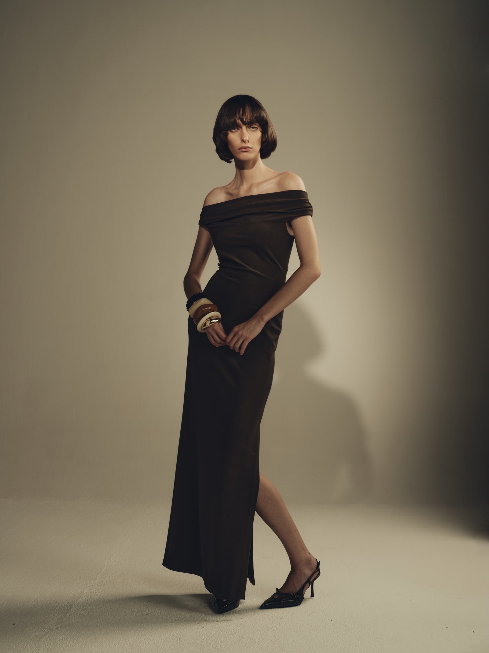 Dark brown off-shoulder maxi dress with draped neckline and side slit