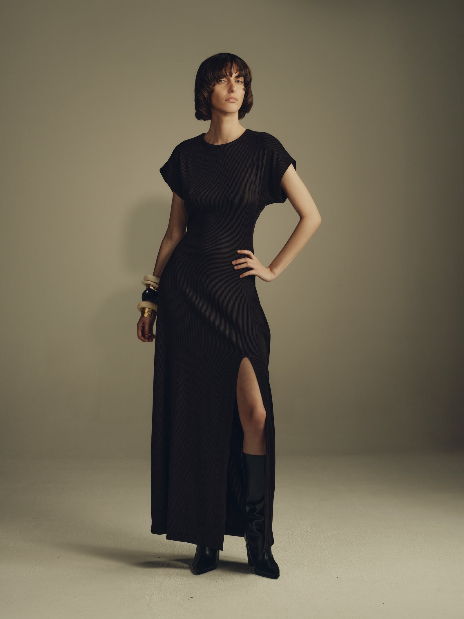 Black minimalist maxi dress with cap sleeves and front slit
