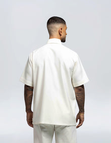 CAMICIA A MANICHE CORTE A TRIANGOLO