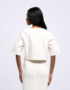 TOP CORTO CON TASCA OVERSIZE 