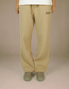 Elamins beige quilted wide-leg trousers with logo detail
