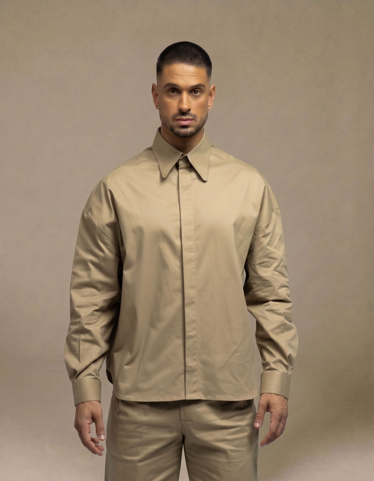 Minimalist sand overshirt with concealed placket, relaxed tailored fit
