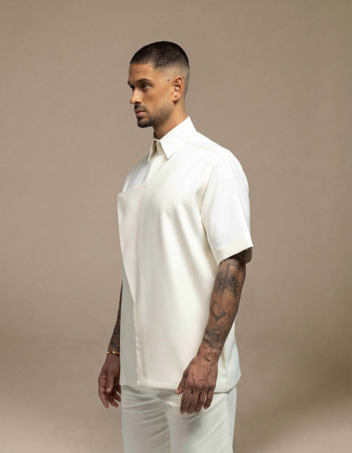 Oversized cream short-sleeve polo shirt minimalist menswear styling
