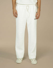 White quilted wide-leg drawstring trousers with Elamins logo detail
