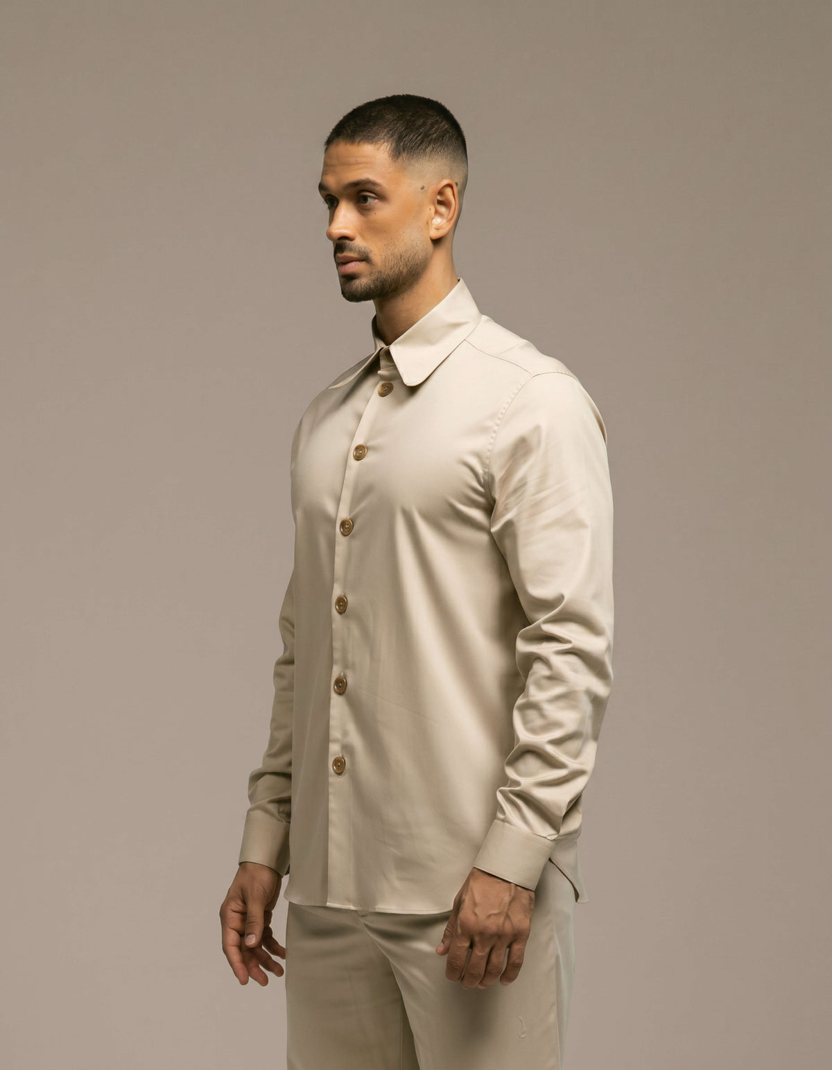 Minimalist sand beige tailored shirt with gold buttons, menswear
