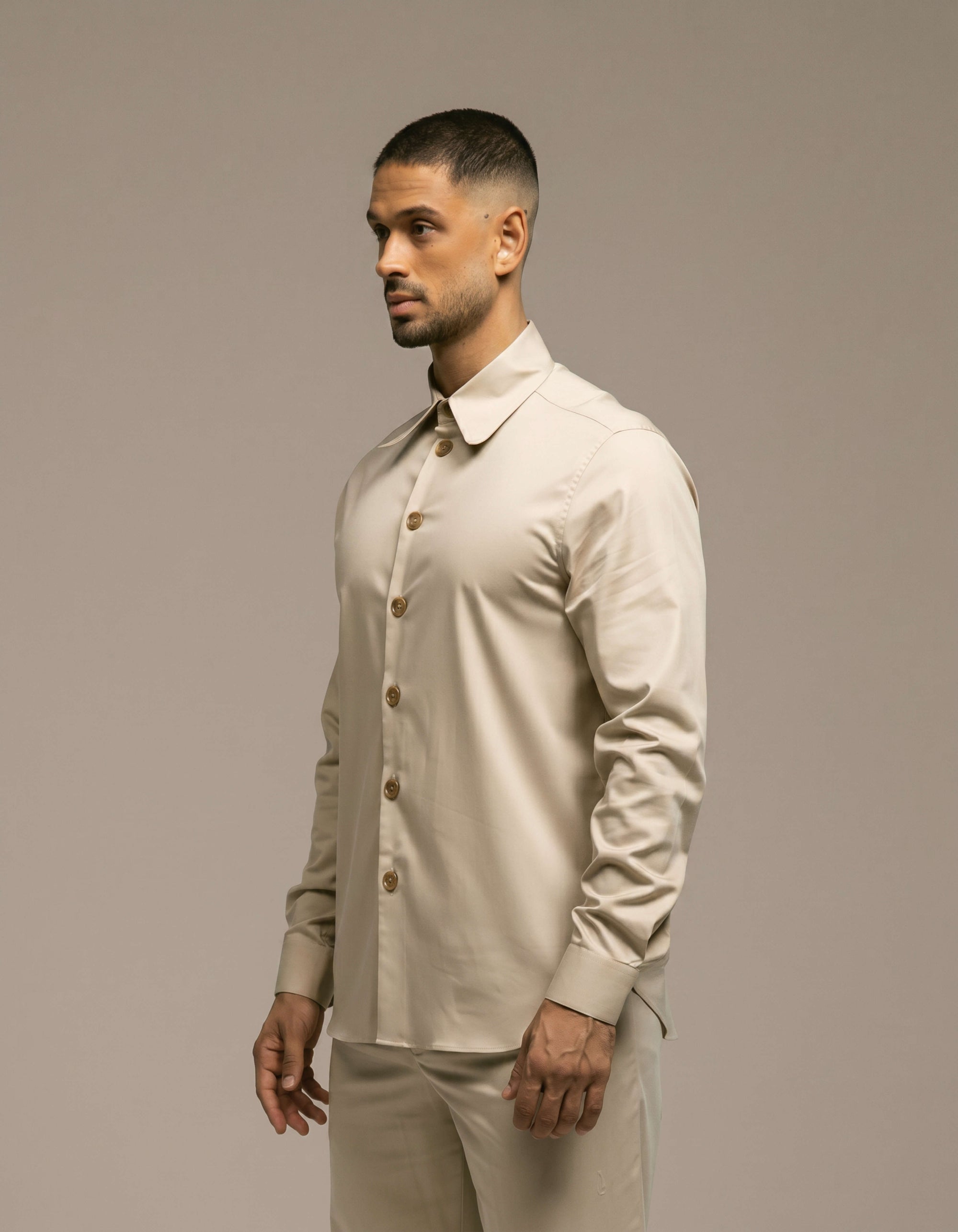 Minimalist sand beige tailored shirt with gold buttons, menswear
