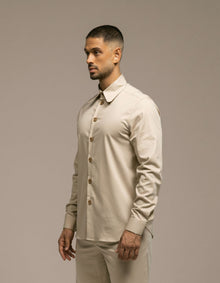 Minimalist sand beige tailored shirt with gold buttons, menswear
