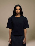 Navy structured boxy top with geometric jacquard texture, short sleeves
