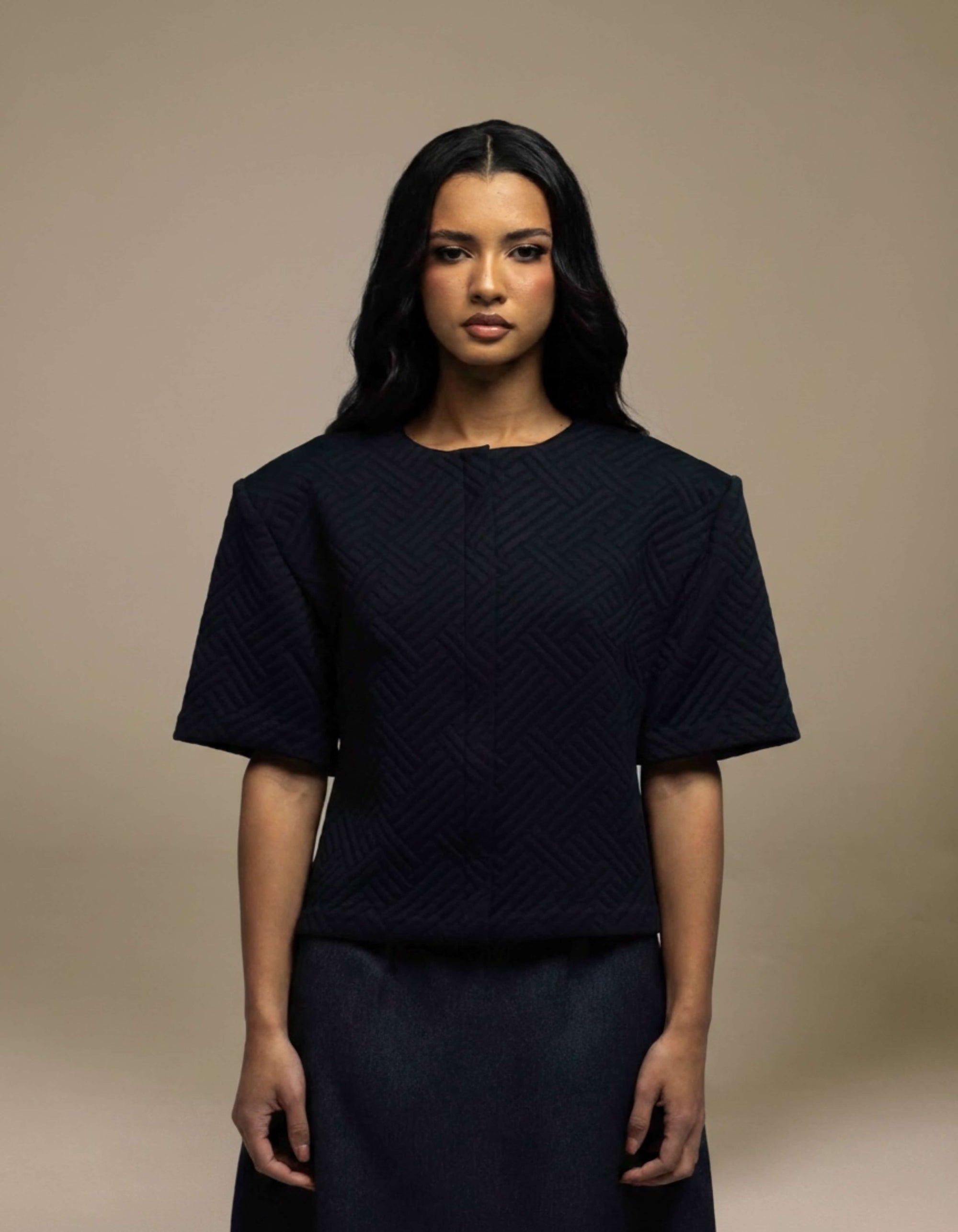 Navy structured boxy top with geometric jacquard texture, short sleeves
