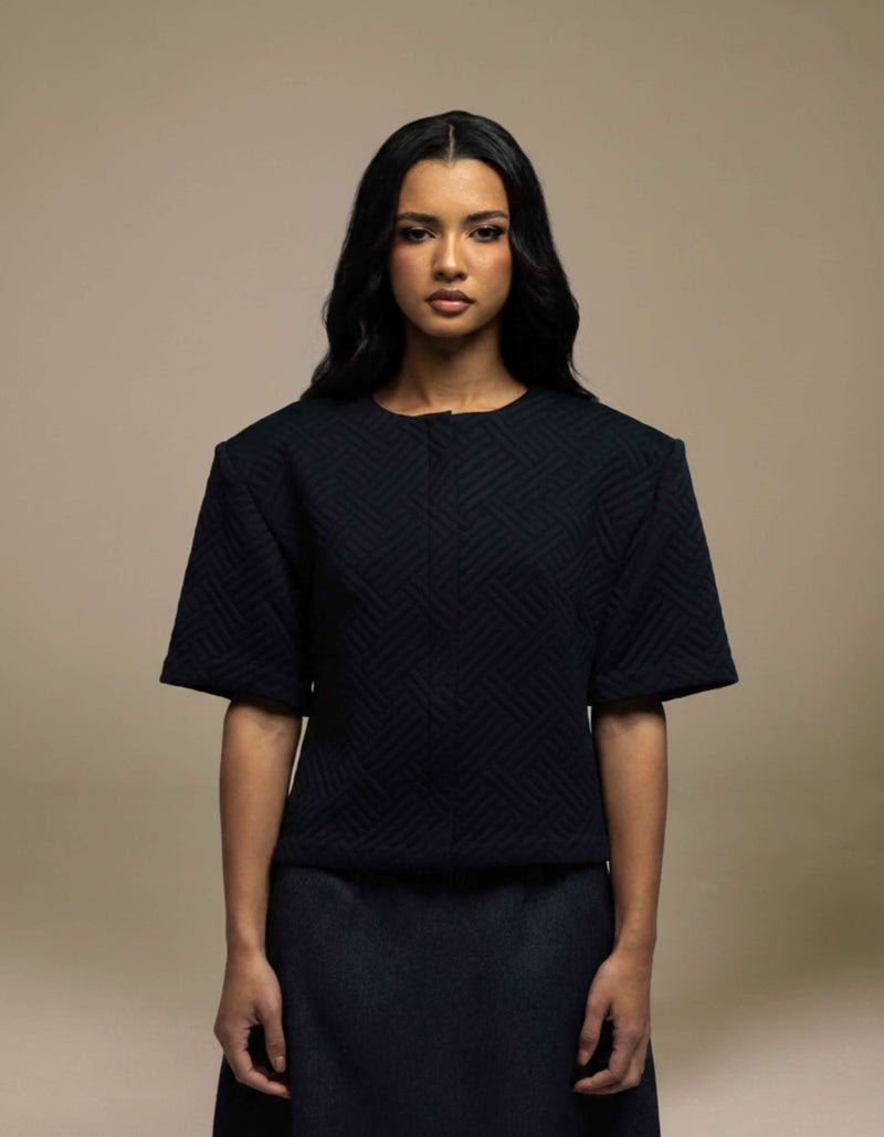 Navy structured boxy top with geometric jacquard texture, short sleeves
