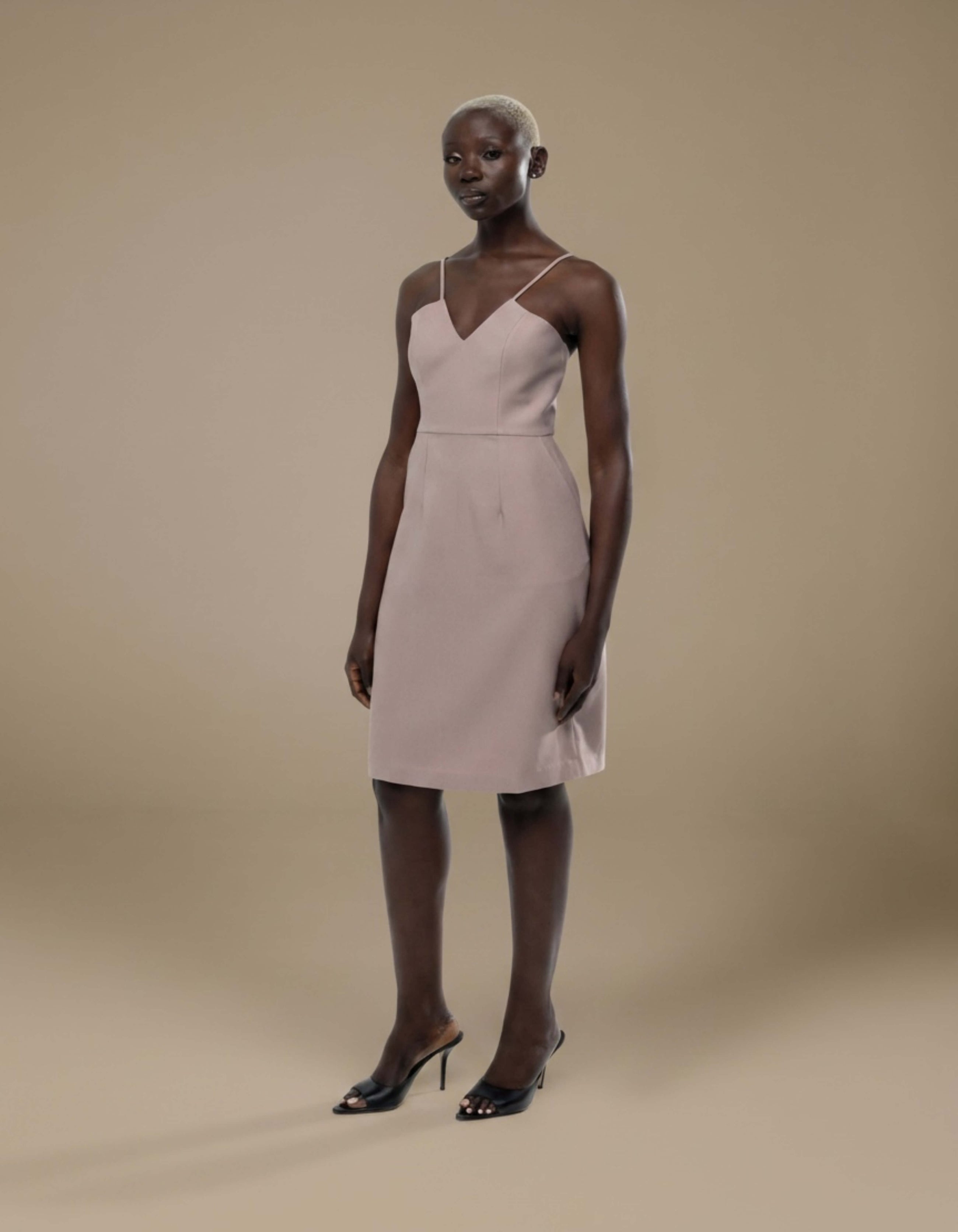 Blush minimalist slip dress with V-neckline and spaghetti straps, knee-length luxury womenswear
