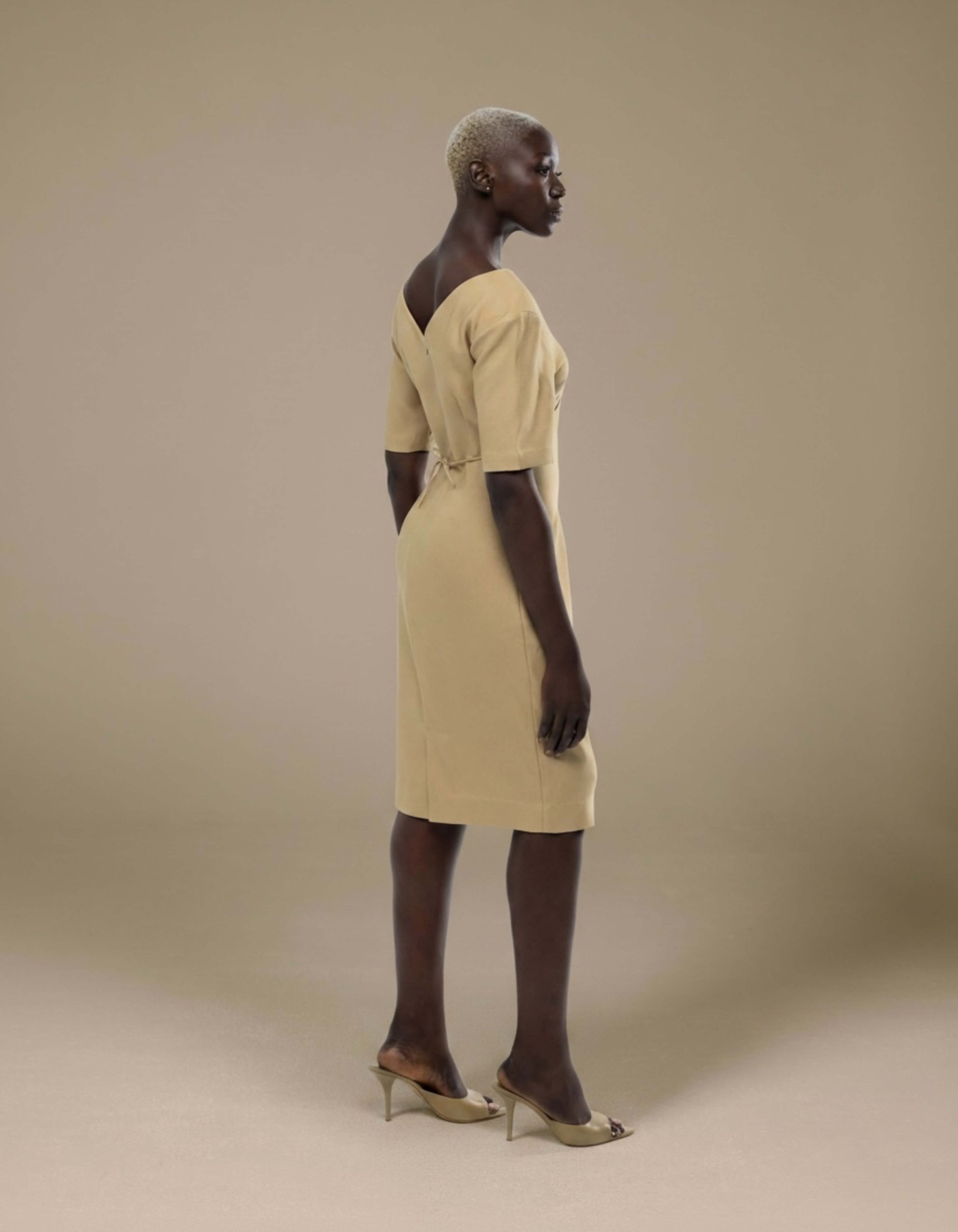 Sand minimalist midi dress with open back tie detail and short sleeves
