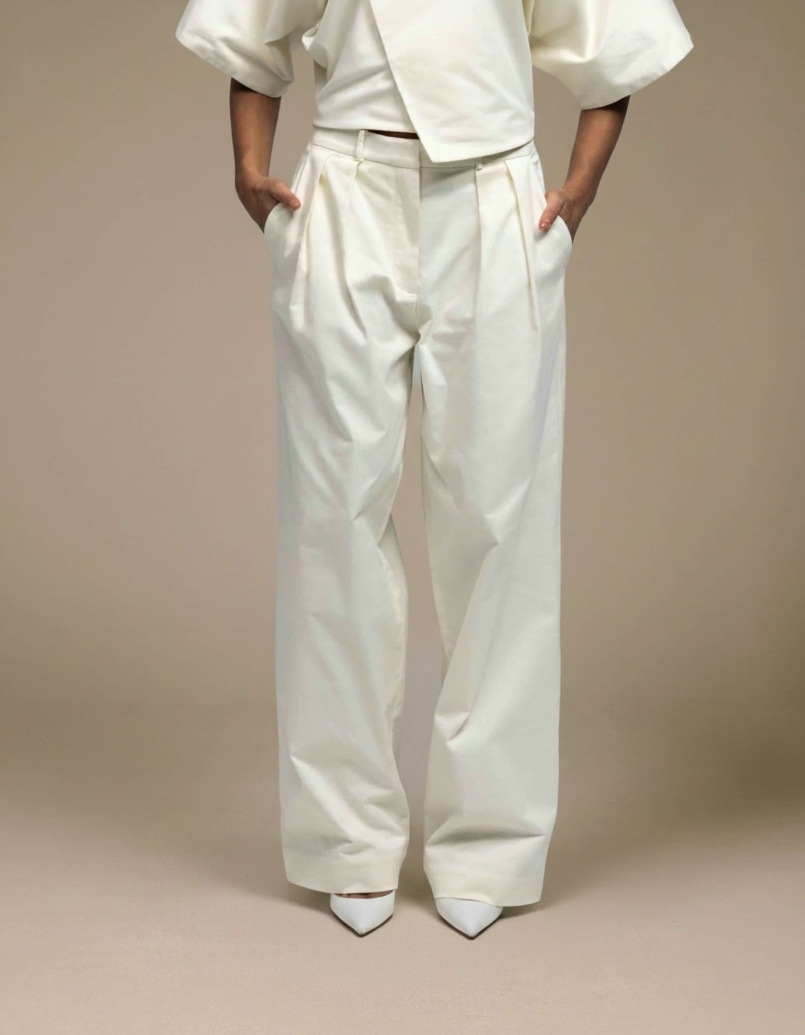 Ivory wide-leg pleated tailored trousers luxury womenswear
