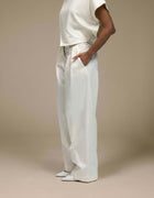 Ivory wide-leg tailored trousers with front pleats, luxury womenswear
