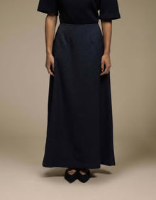 Tailored navy maxi skirt A-line silhouette luxury womenswear
