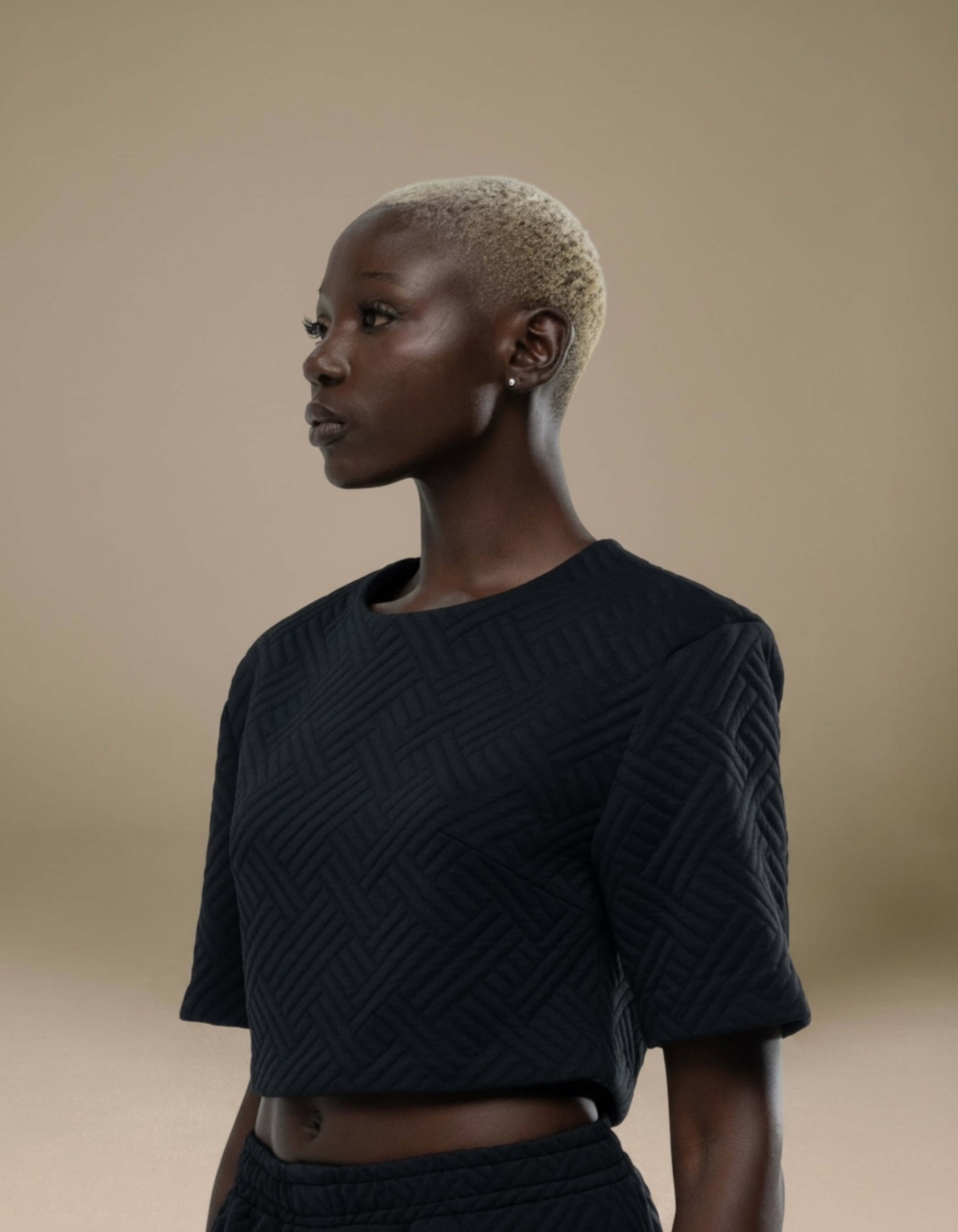Black quilted geometric crop top, short sleeve minimalist luxury womenswear Elamins

