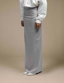 Minimalist silver-grey satin maxi skirt tailored column silhouette luxury womenswear

