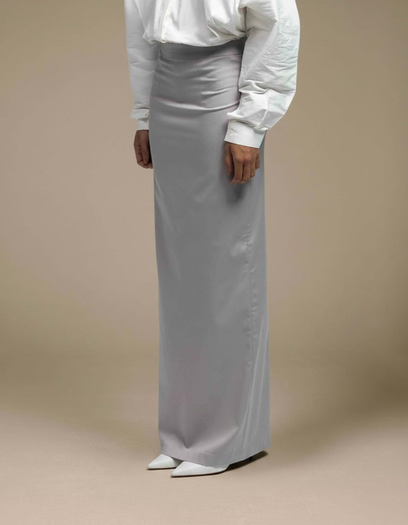 Minimalist silver-grey satin maxi skirt tailored column silhouette luxury womenswear

