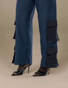 Navy wide-leg cargo trousers with contrast patch pockets styled with heels
