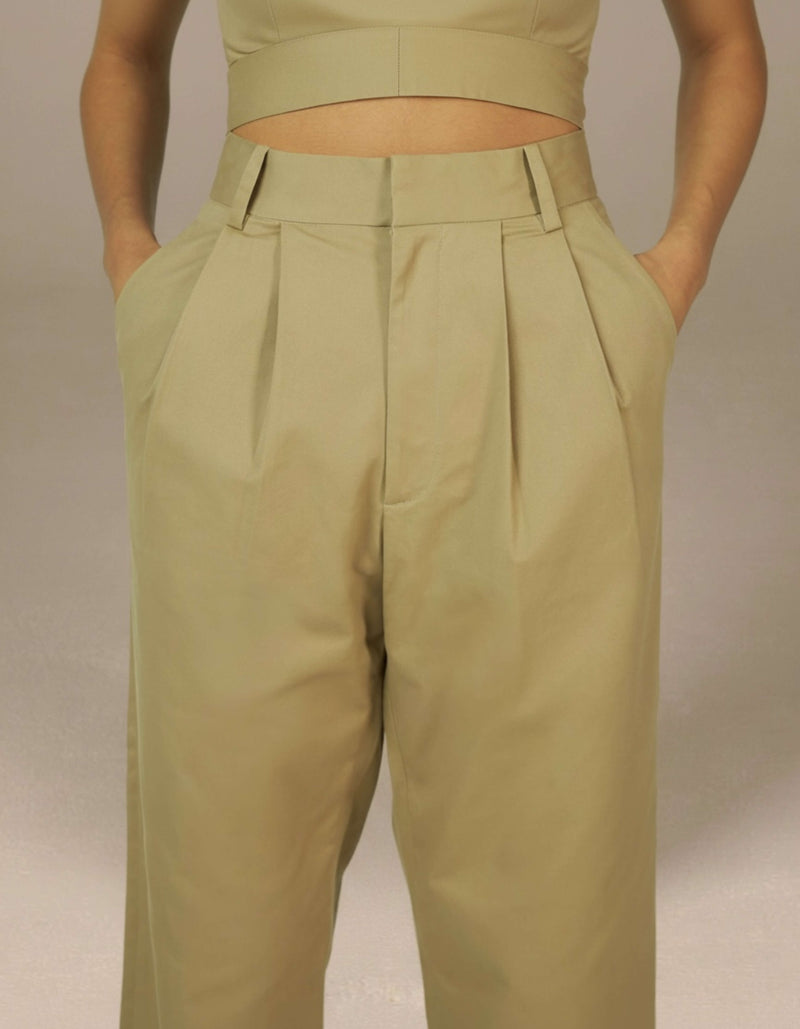 Sage green high-waist pleated tailored trousers luxury womenswear
