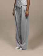 Tailored wide-leg grey trousers with pleated front detail, luxury womenswear
