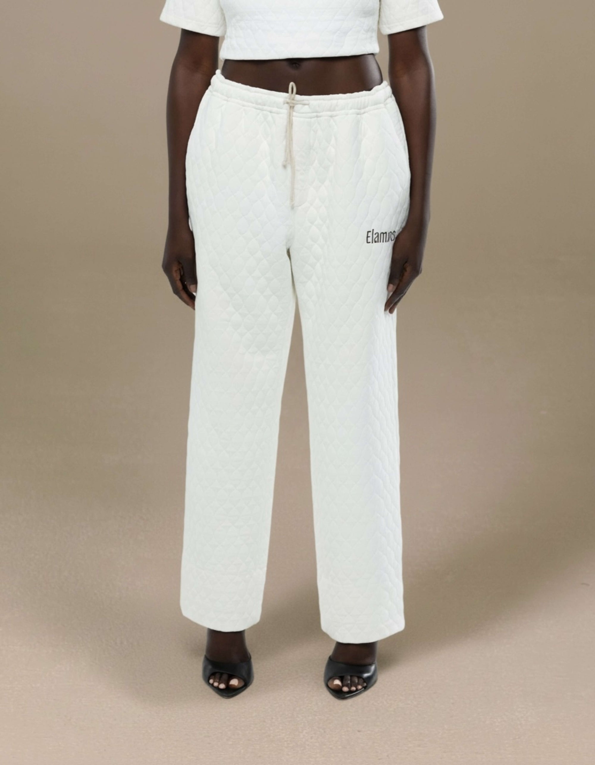 Ivory quilted wide-leg drawstring trousers with Elamins logo detail
