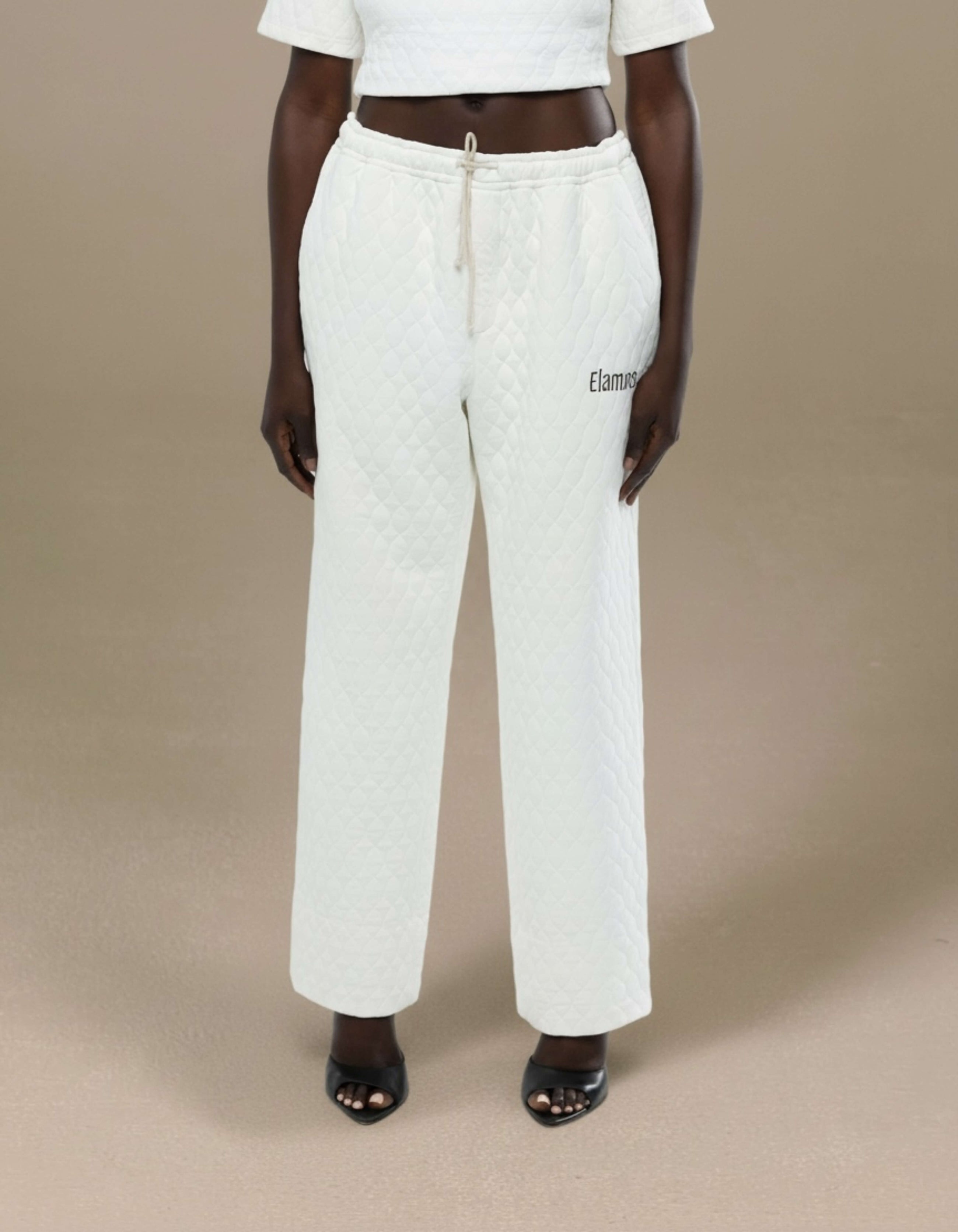 Ivory quilted wide-leg drawstring trousers with Elamins logo detail
