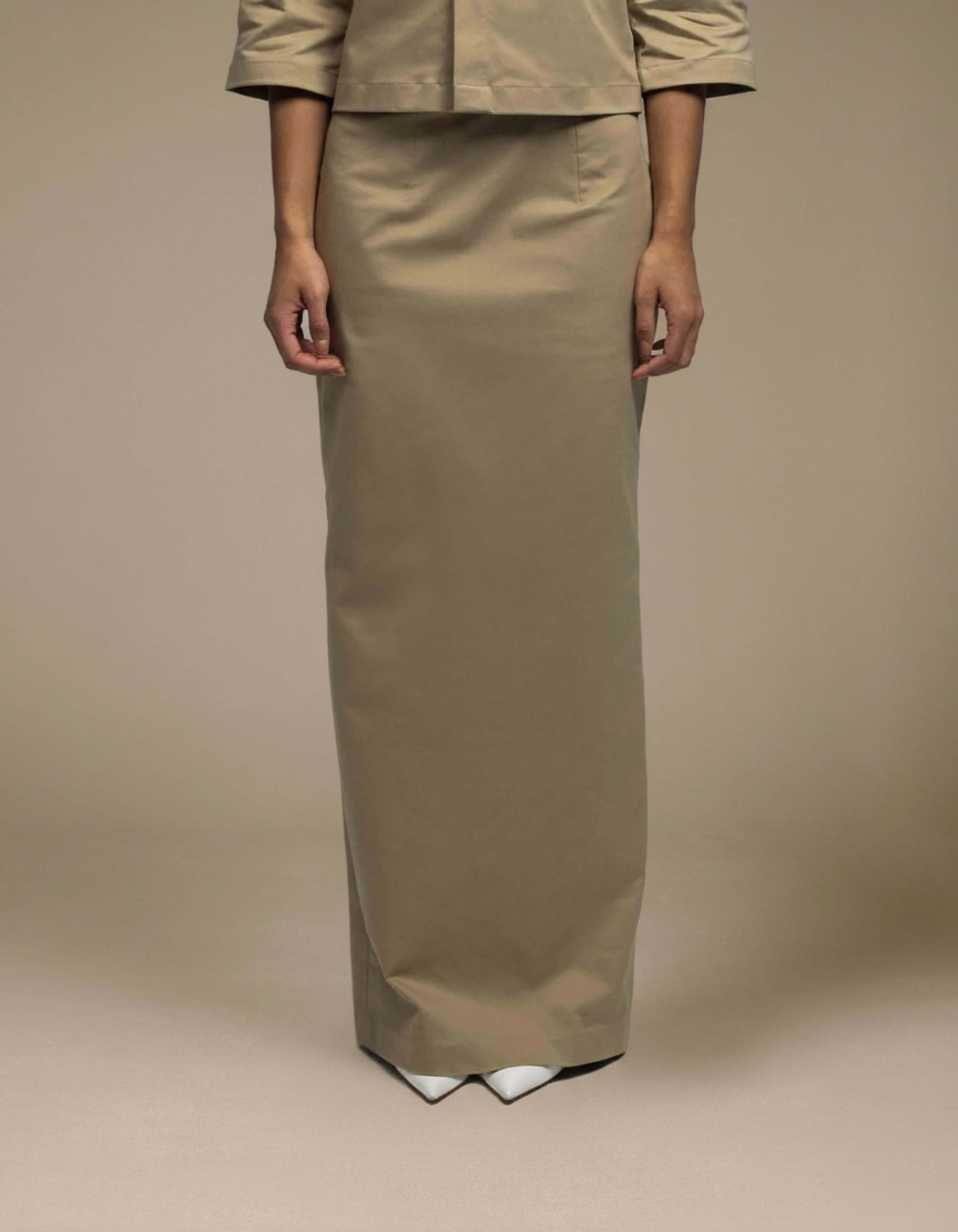 Tailored khaki maxi skirt minimalist column silhouette luxury womenswear

