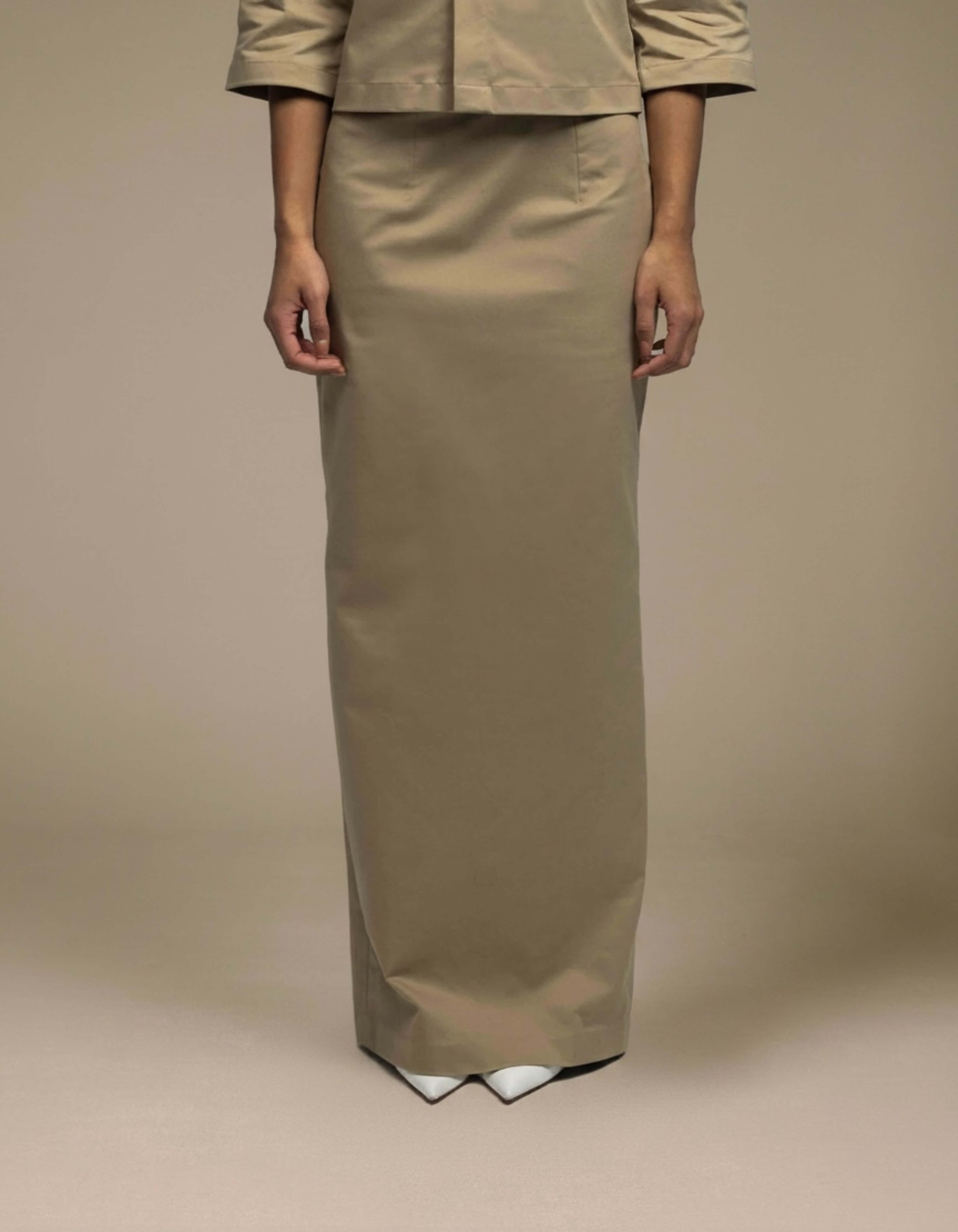 Tailored khaki maxi skirt minimalist column silhouette luxury womenswear
