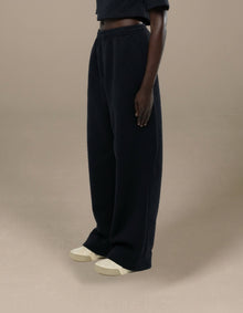 Black quilted wide-leg trousers with geometric texture, luxury womenswear
