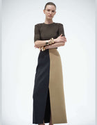 Model Wearing The Elamins Vertical Two Tone Maxi Skirt In Tan And Denim With The Three Quarter Sleeve Top, Showing The High-Rise Waist And Vertical Color Blocking.