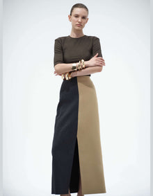 Model Wearing The Elamins Vertical Two Tone Maxi Skirt In Tan And Denim With The Three Quarter Sleeve Top, Showing The High-Rise Waist And Vertical Color Blocking.