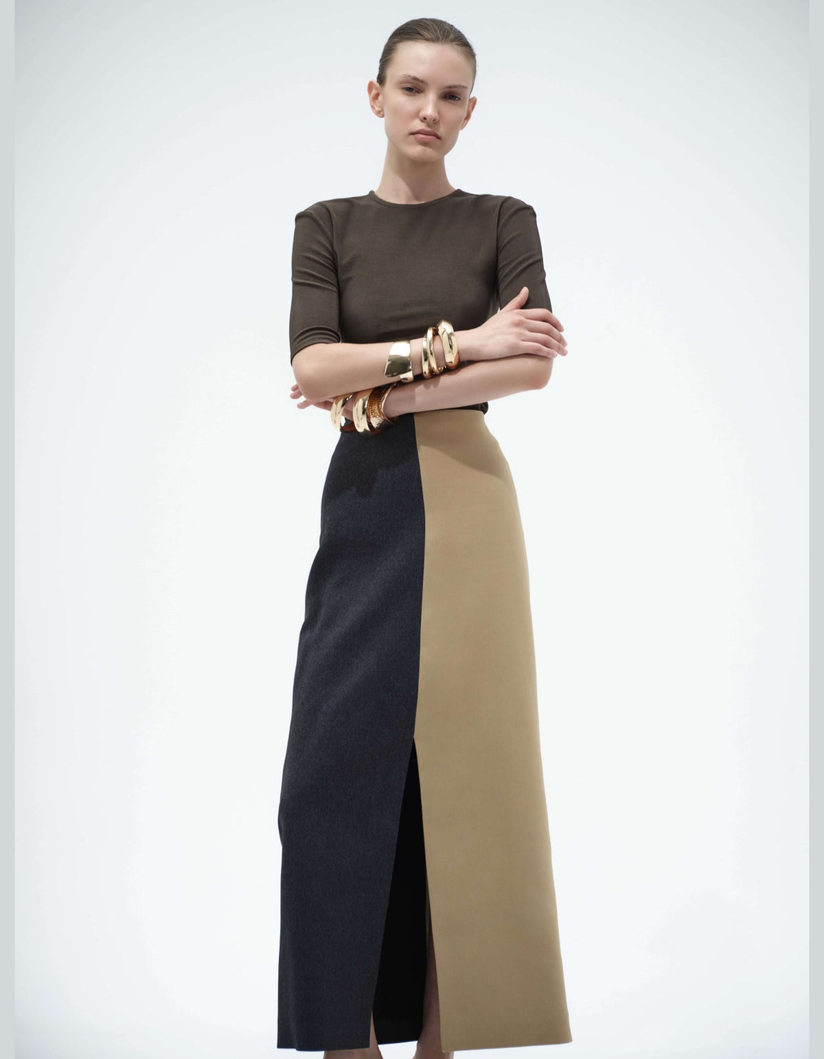 Model Wearing The Elamins Vertical Two Tone Maxi Skirt In Tan And Denim With The Three Quarter Sleeve Top, Showing The High-Rise Waist And Vertical Color Blocking.