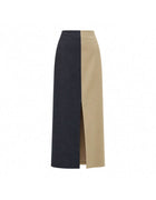 Elamins Vertical Two Tone Maxi Skirt In Tan And Denim Displayed Against A White Background, Featuring Contrasting Denim-Style And Smooth Panels With A Front Slit.