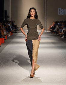 Model Wearing The Elamins Vertical Two Tone Skirt In Tan And Denim Paired With The Elamins Three Quarter Sleeve Top At TheEventDXB Fashion Show.